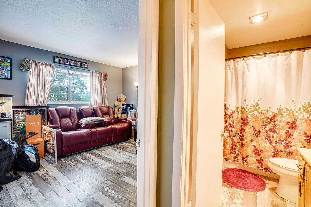 1900 South Kanner Highway, Unit 9206 Stuart, FL 34994 - Photo 14 of 23 a living room with furniture and a large window