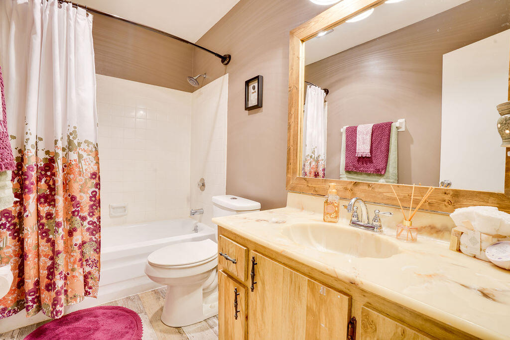 1900 South Kanner Highway, Unit 9206 Stuart, FL 34994 - Photo 15 of 23 a bathroom with a granite countertop sink toilet and shower