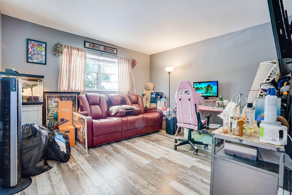 1900 South Kanner Highway, Unit 9206 Stuart, FL 34994 - Photo 16 of 23 a living room with furniture and a window