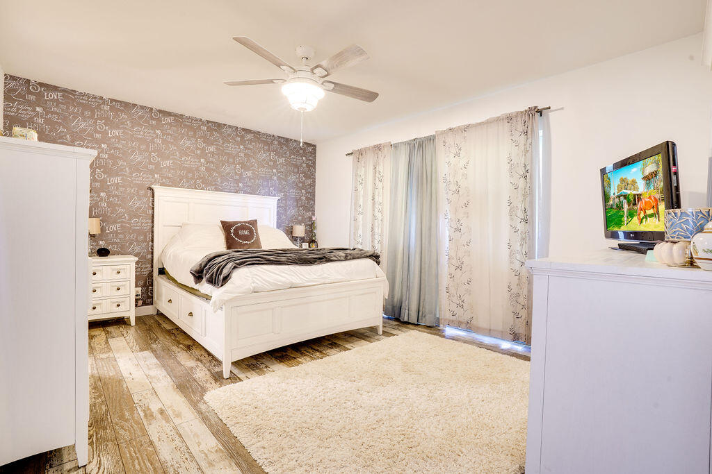 1900 South Kanner Highway, Unit 9206 Stuart, FL 34994 - Photo 17 of 23 a living room with furniture and a chandelier