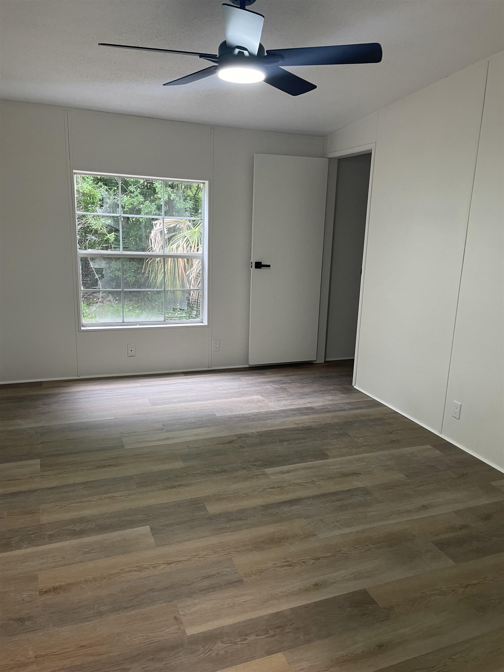 350 Varella Avenue St. Augustine, FL 32084 - Photo 14 of 17 a view of an empty room with wooden floor and a window