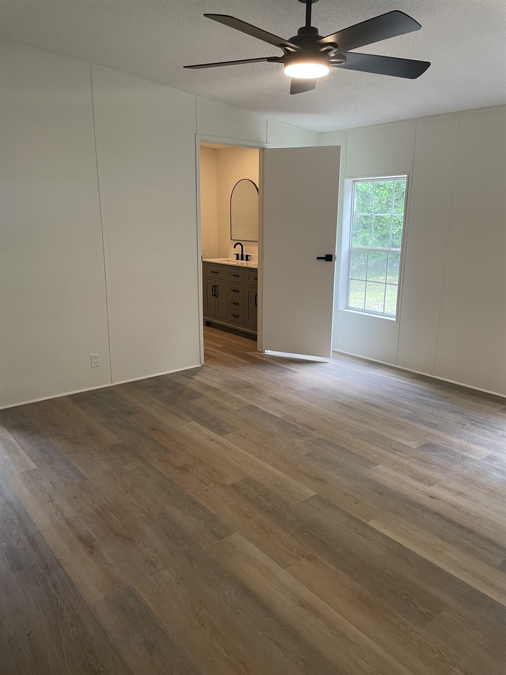 350 Varella Avenue St. Augustine, FL 32084 - Photo 8 of 17 wooden floor in an empty room with a window