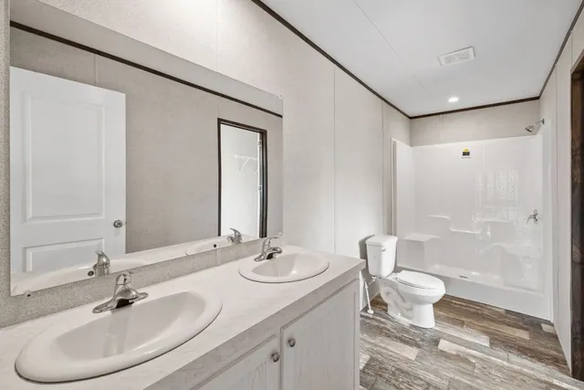 a bathroom with a glass shower door