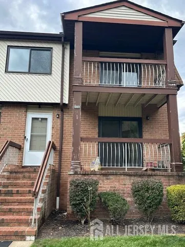 a view of a house with a deck door