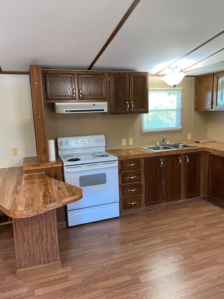 313 Lonesome Pine Road Bybee, TN 37713 - Photo 16 of 48 a kitchen with stainless steel appliances granite countertop a stove and a sink