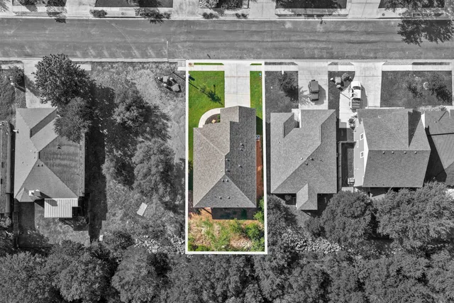an aerial view of a house with a garden