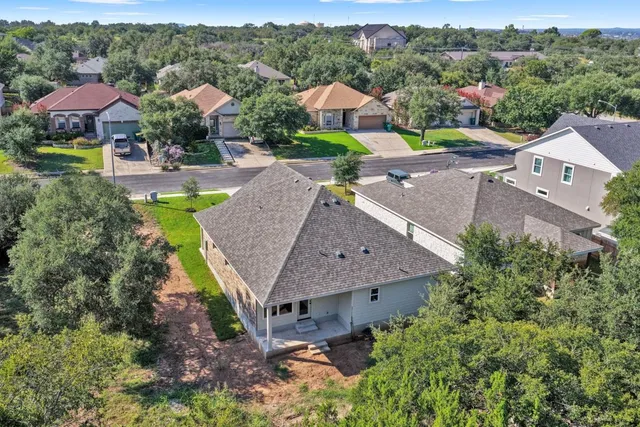 an aerial view of a house with a garden