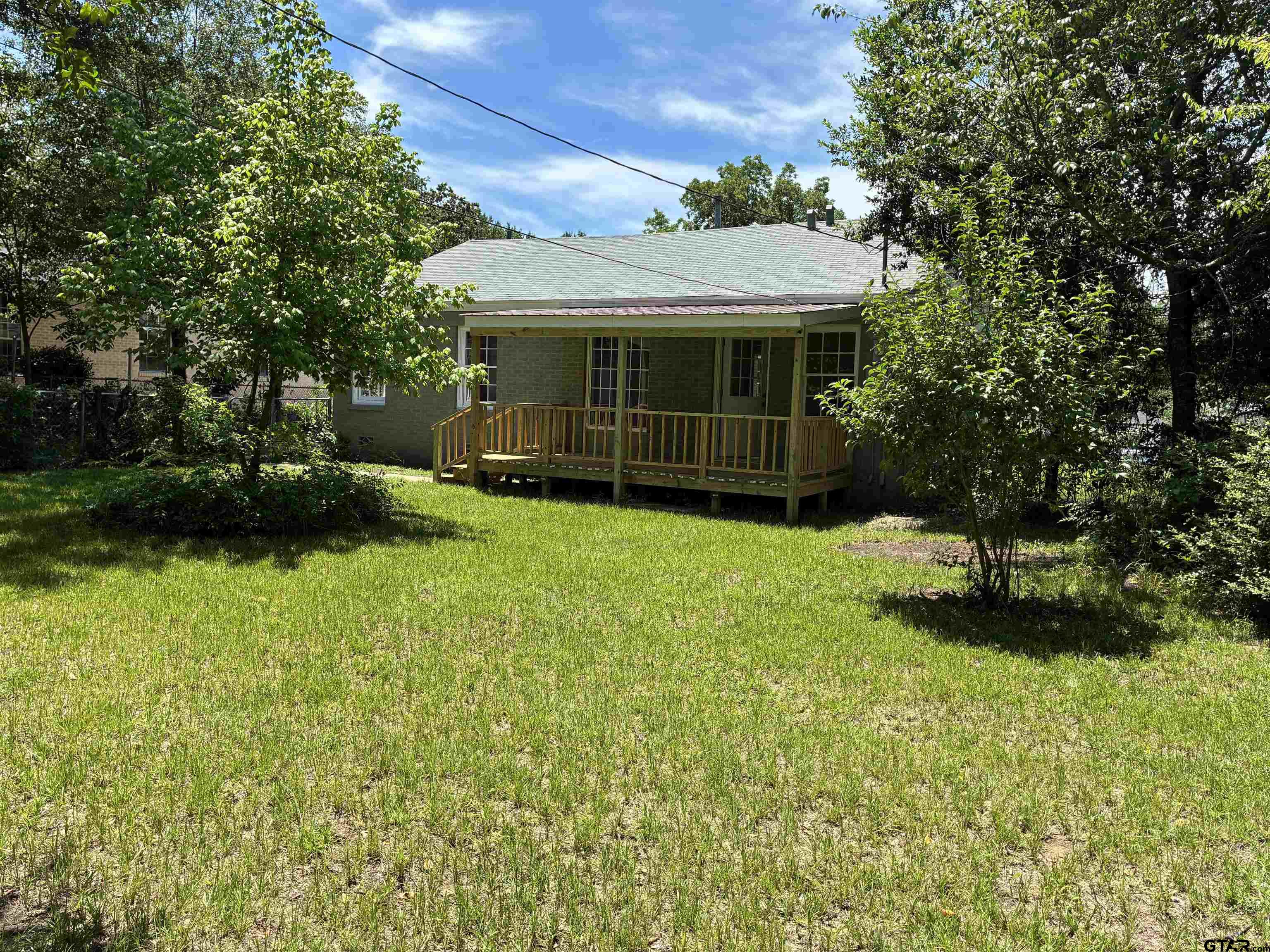 811 West 5th Street Tyler, TX 75701 - Photo 25 of 26 front view of a house with a yard