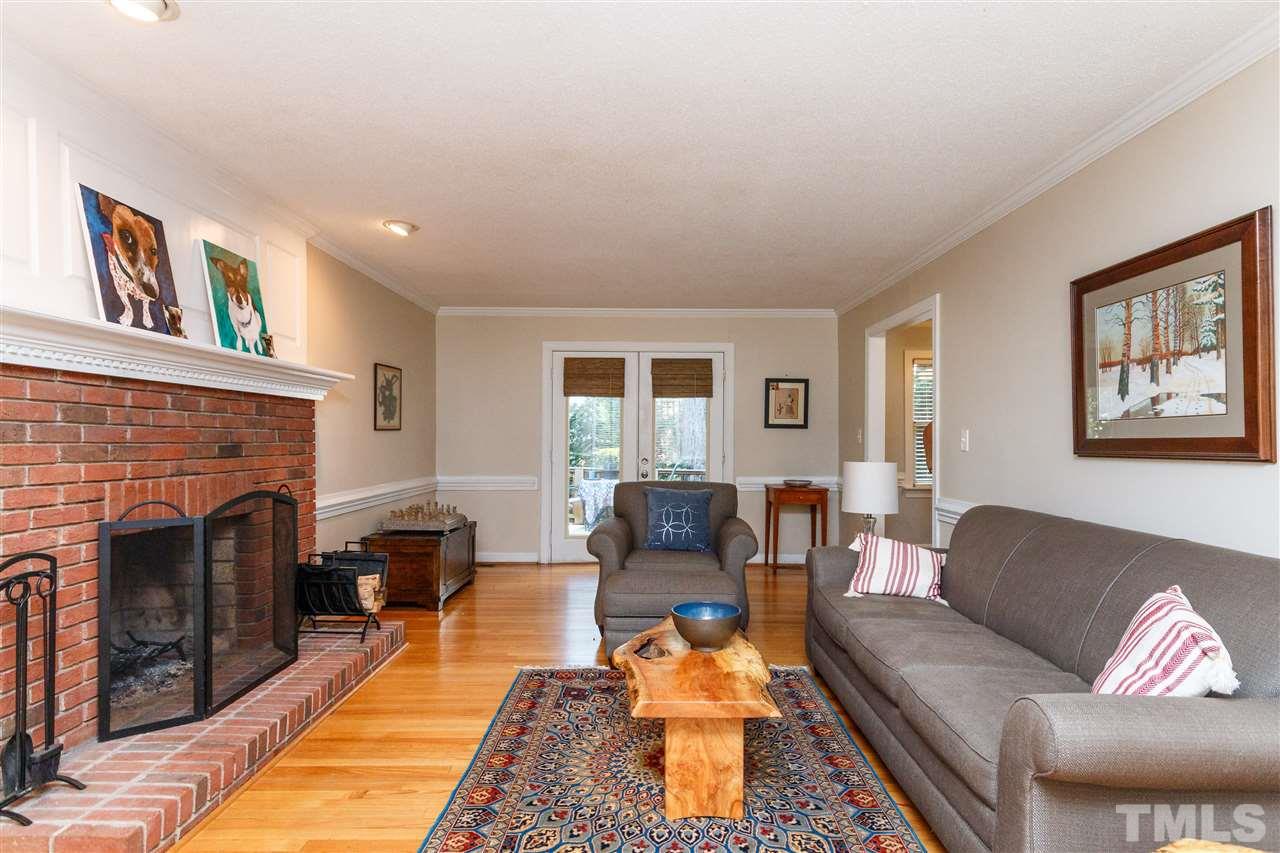 4500 Rutland Court Raleigh, NC 27613 - Photo 11 of 23 a living room with furniture and a fireplace
