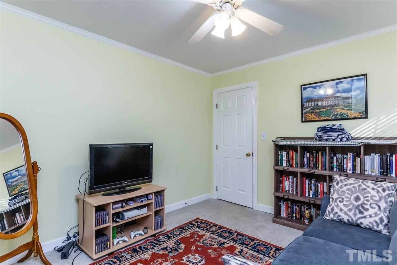 4500 Rutland Court Raleigh, NC 27613 - Photo 13 of 23 a room with furniture and a flat screen tv