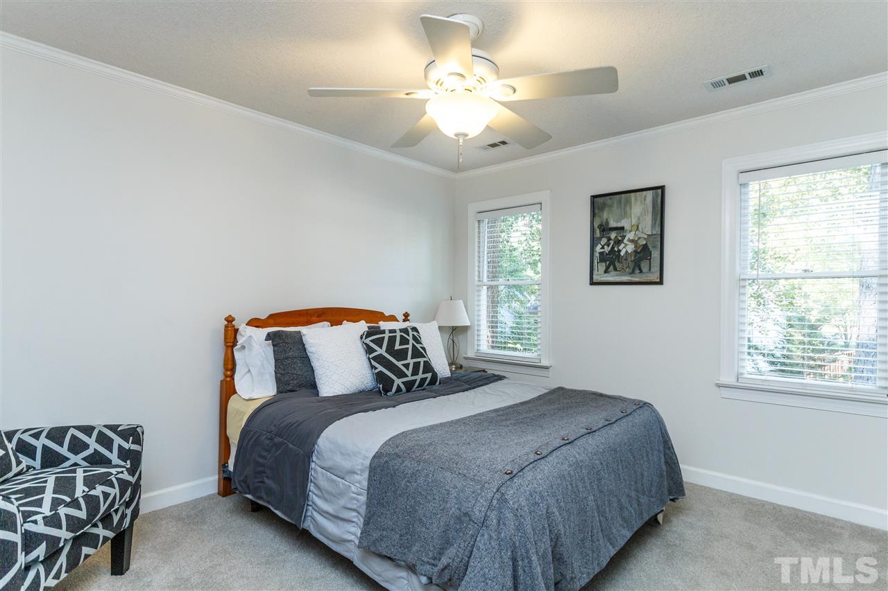 4500 Rutland Court Raleigh, NC 27613 - Photo 14 of 23 a bedroom with bed and window