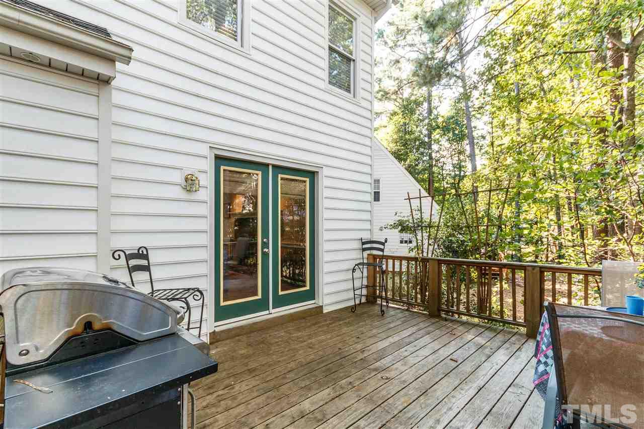 4500 Rutland Court Raleigh, NC 27613 - Photo 21 of 23 a view of a deck with wooden floor and fence and a barbeque