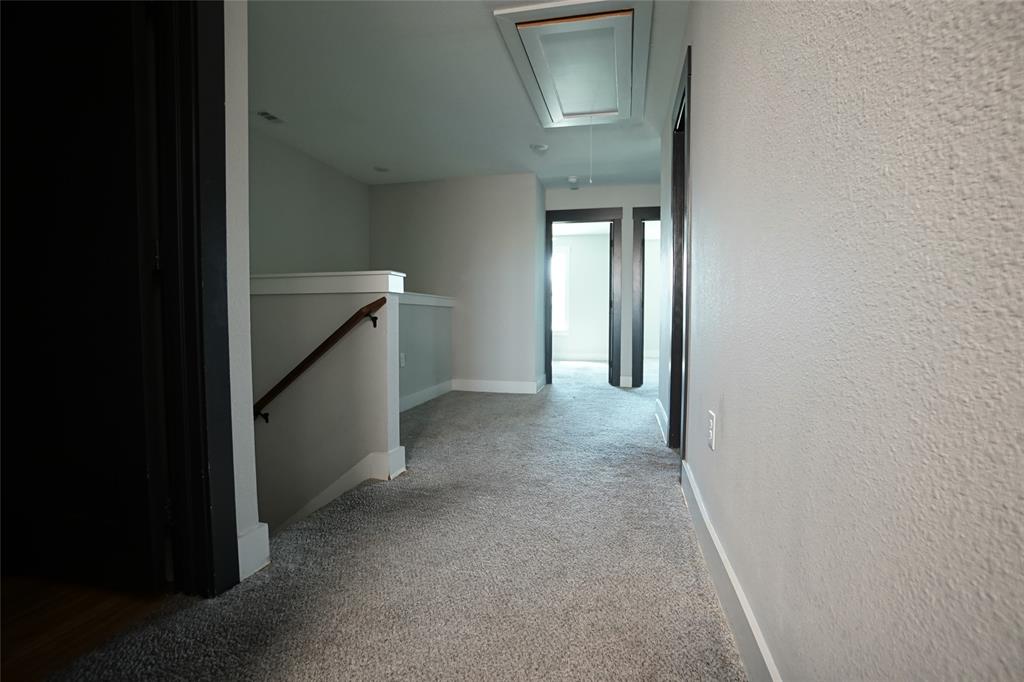 1764 Palladio Loop Princeton, TX 75407 - Photo 37 of 40 Upper-level hallway featuring textured walls and plush carpeting