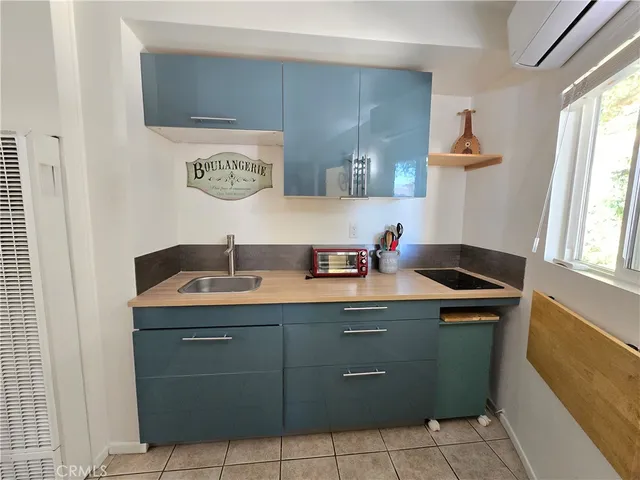 a room with a sink and a mirror