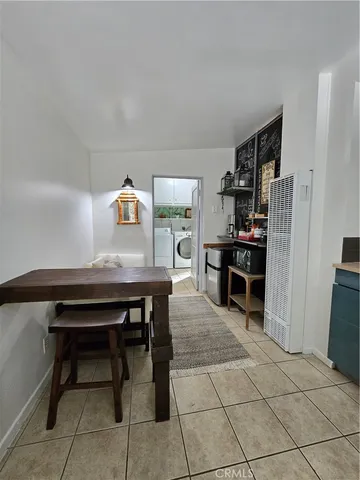 a room with furniture a table and chairs