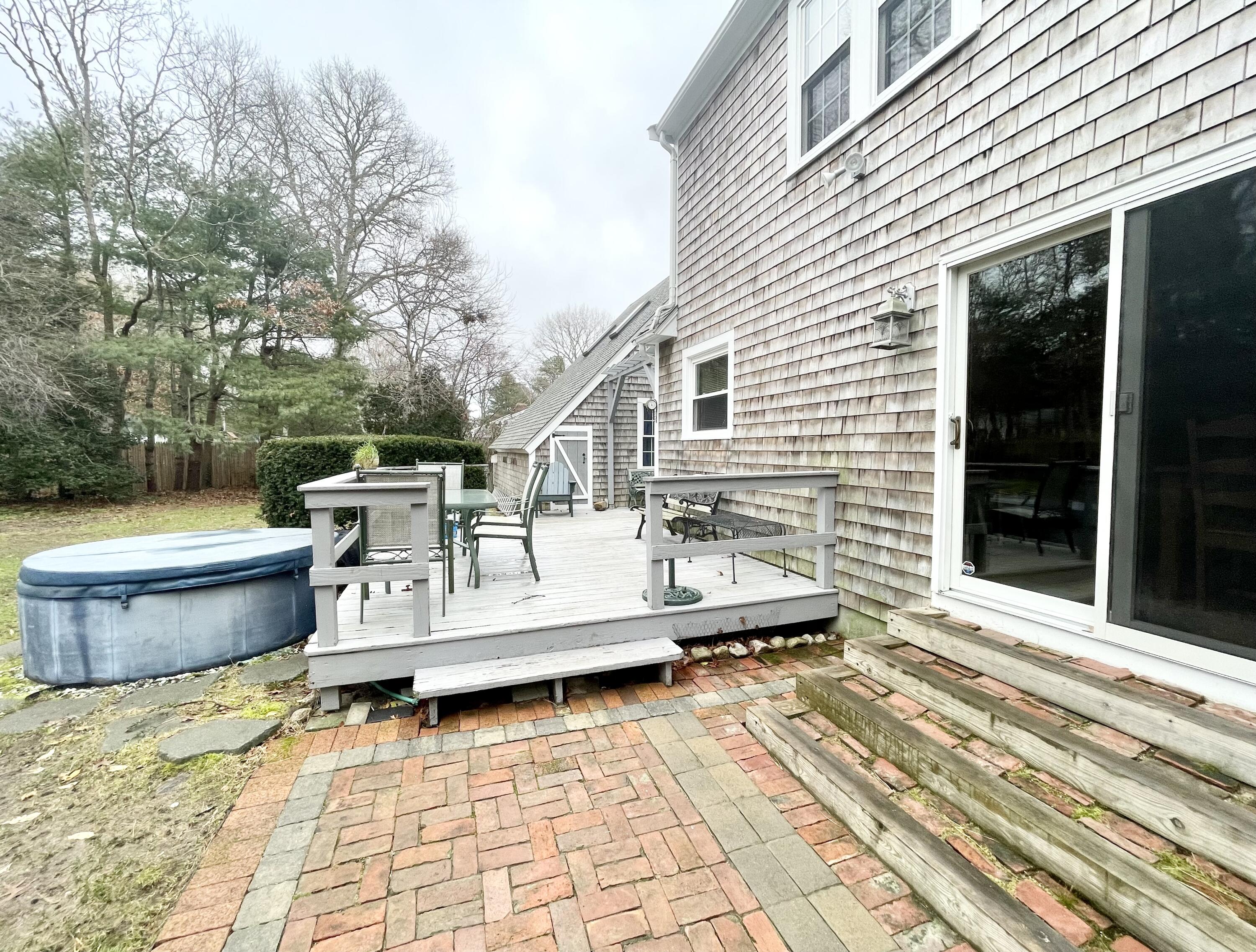 89 Sheaffer Road Centerville, MA 02632 - Photo 8 of 58 rear PT deck.brick patios.jacuzzi