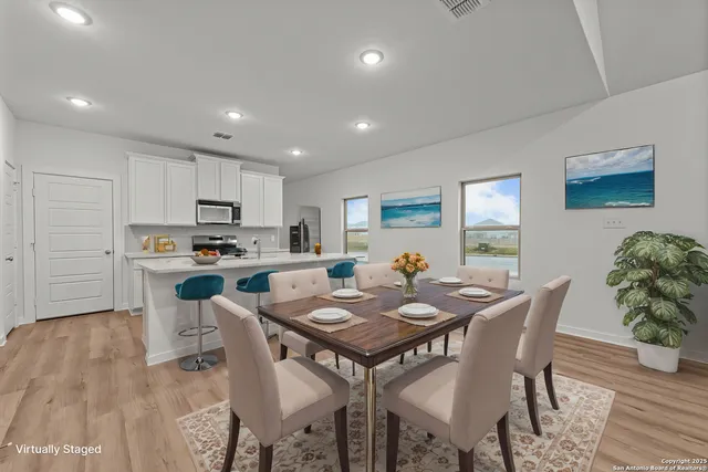 a bedroom with a bed and a potted plant