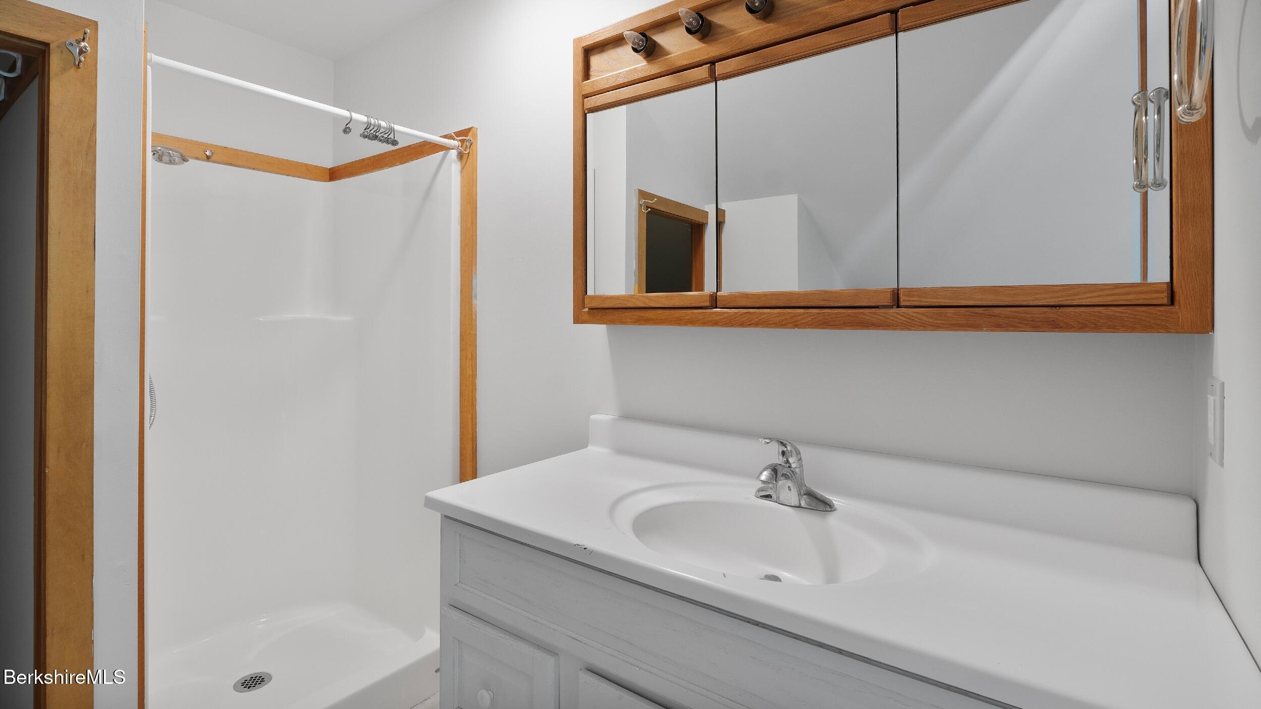 173 Hillsdale Road Egremont, MA 01230 - Photo 76 of 82 a bathroom with a sink and a mirror