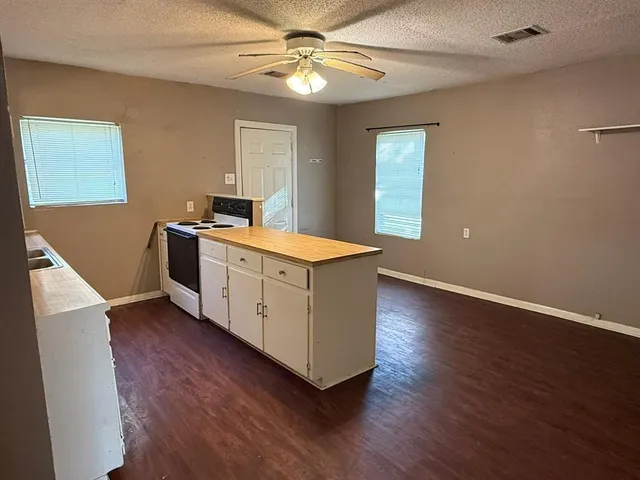 a view of workspace with wooden floor