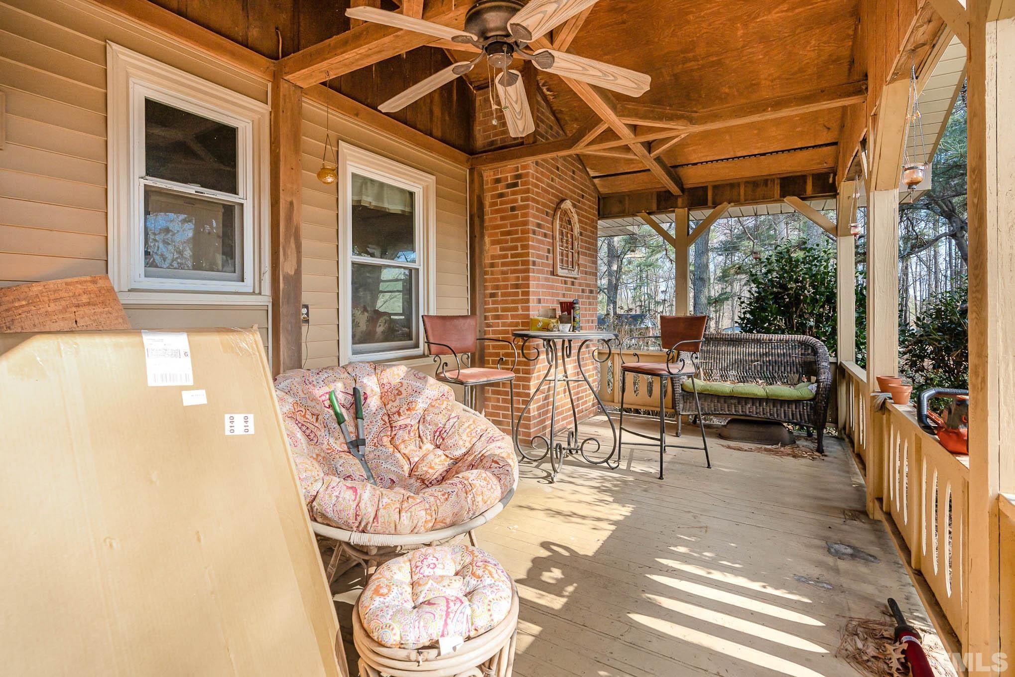 1613 Sanders Road Stem, NC 27581 - Photo 15 of 19 a living room with furniture and a large window