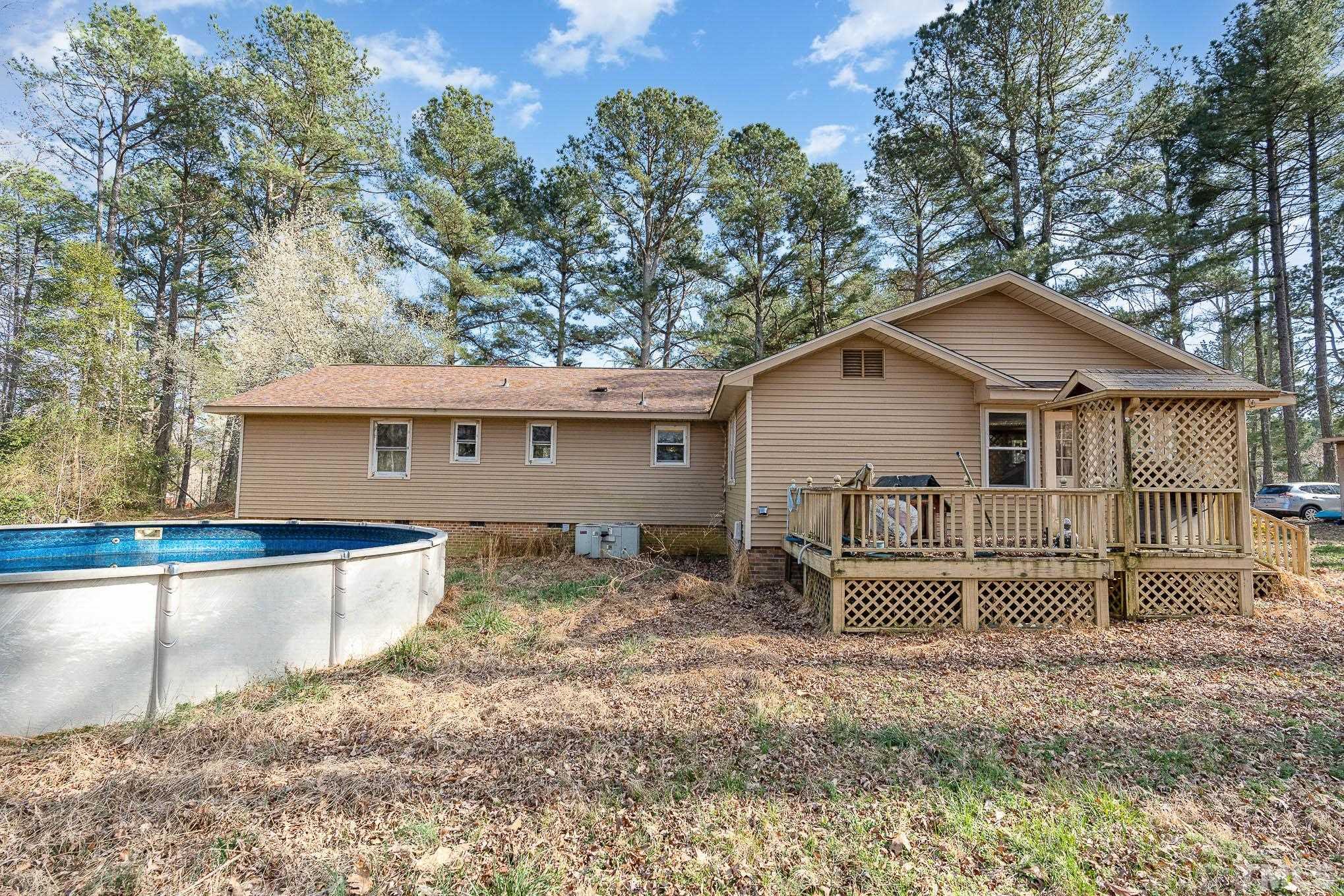 1613 Sanders Road Stem, NC 27581 - Photo 16 of 19 a front view of a house with garden
