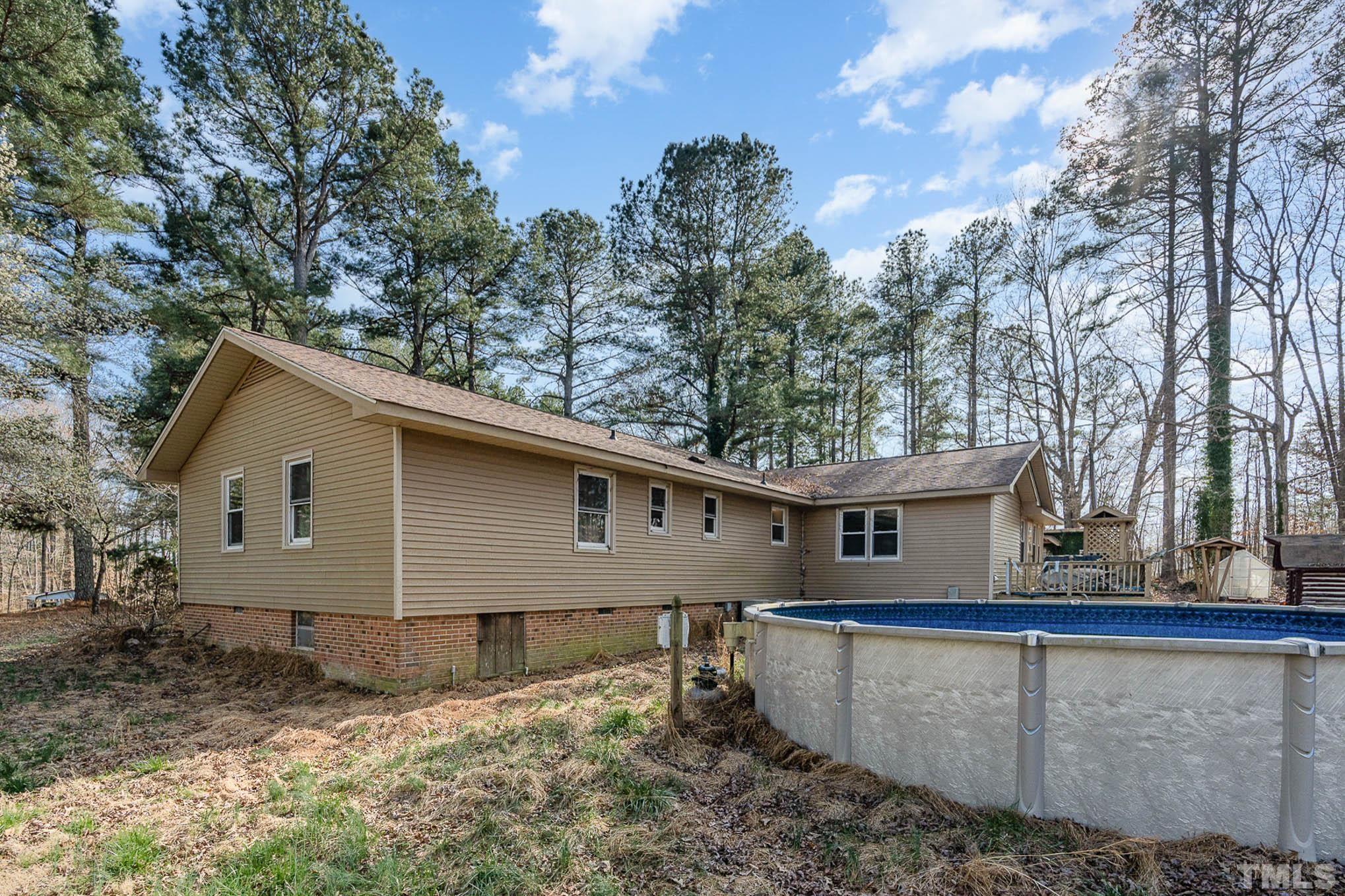 1613 Sanders Road Stem, NC 27581 - Photo 18 of 19 a view of a house with a yard