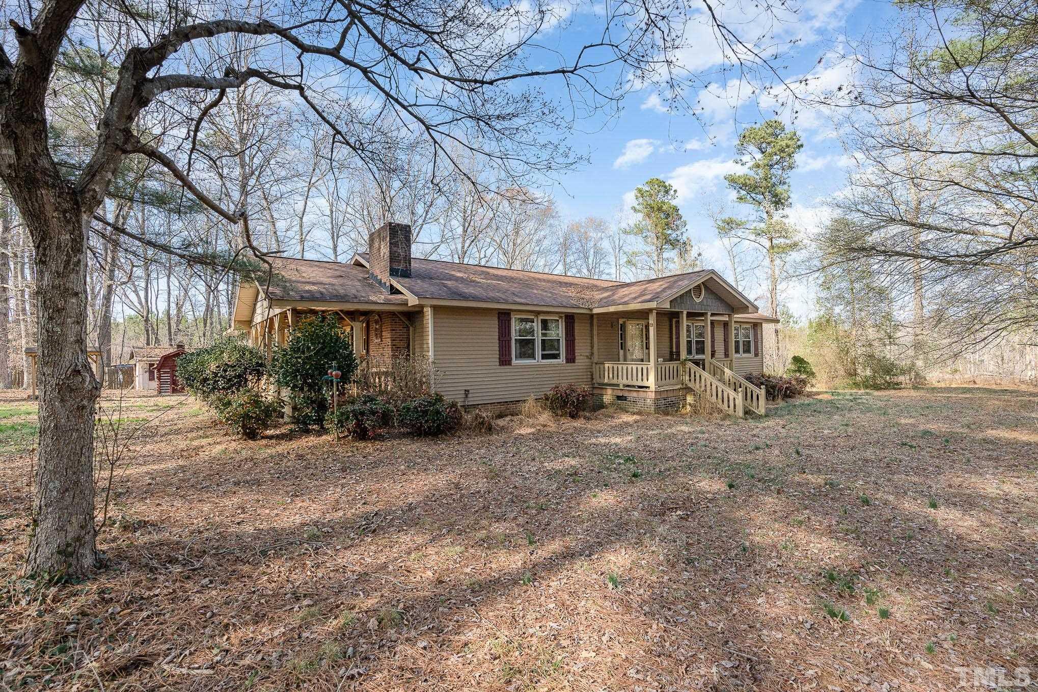 1613 Sanders Road Stem, NC 27581 - Photo 2 of 19 a view of a house with a yard