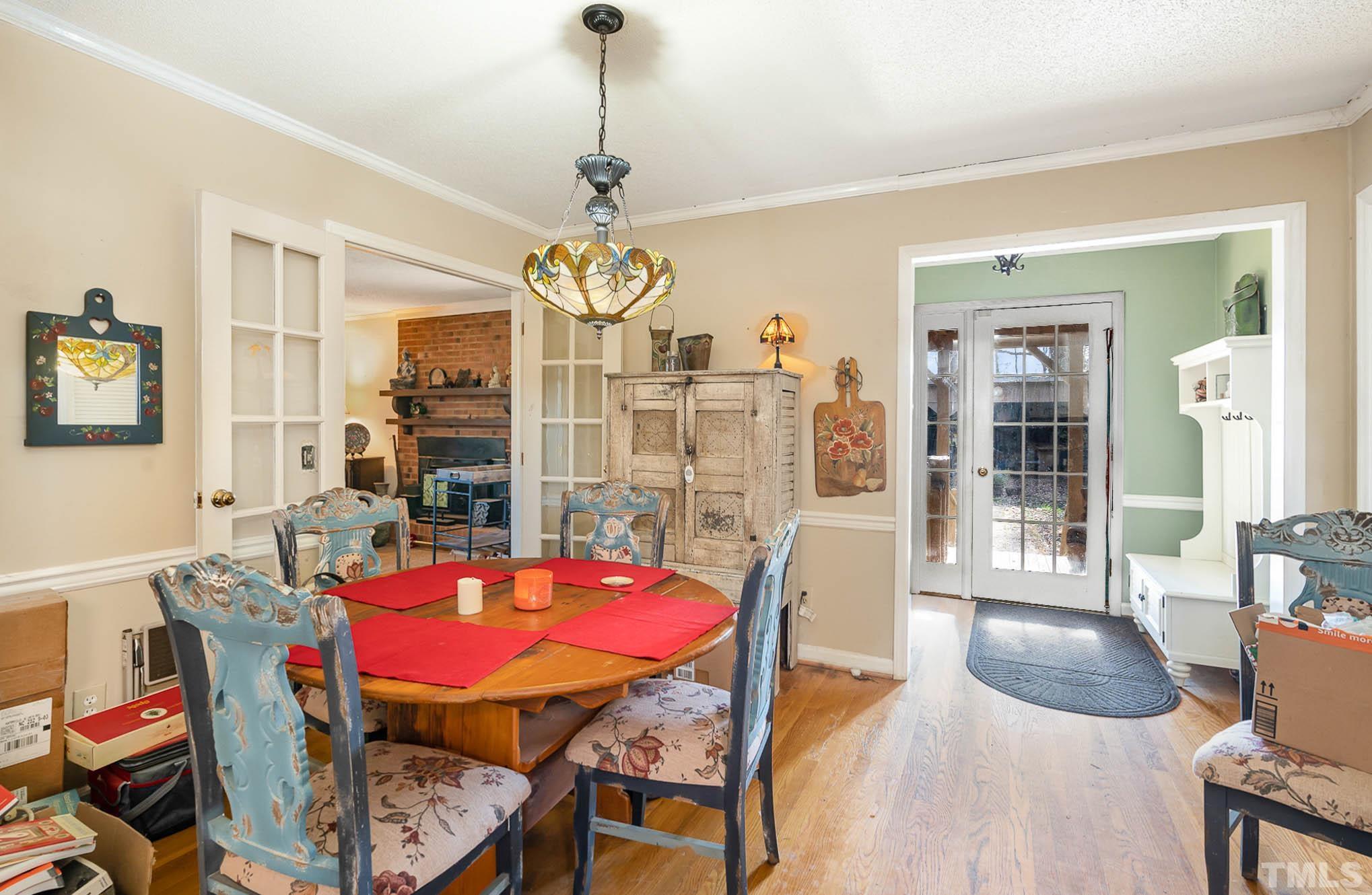 1613 Sanders Road Stem, NC 27581 - Photo 7 of 19 a view of a dining room with furniture