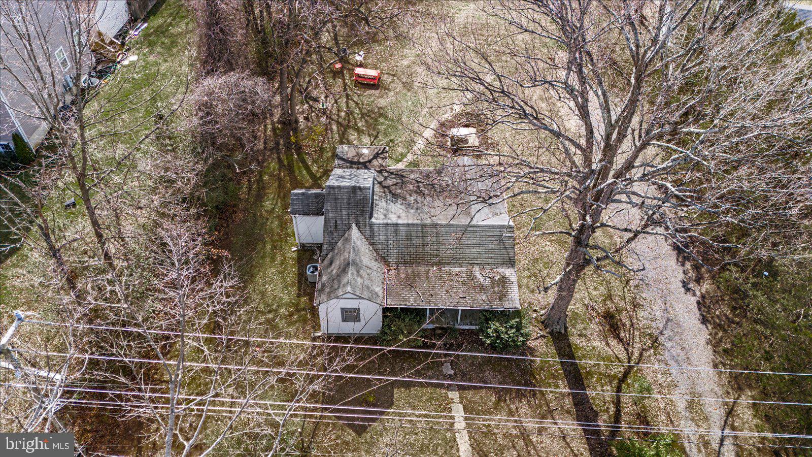 140 Barrett Heights Road Stafford, VA 22554 - Photo 28 of 39 a small barn with a bench in front of it