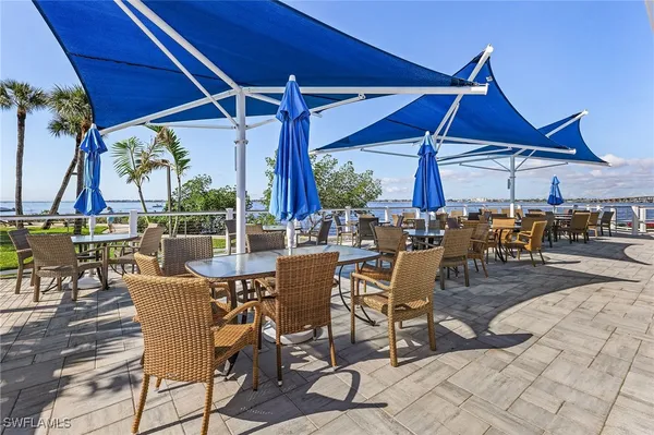a view of a swimming pool with outdoor seating