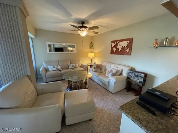a living room with furniture and a rug