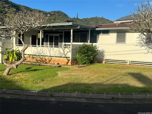 a view of a house with a yard