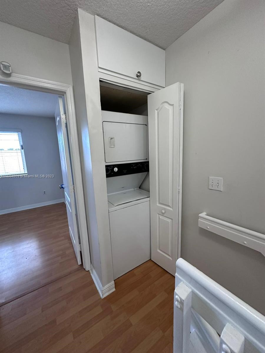 8260 Northwest 10th Street, Unit 7 Miami, FL 33126 - Photo 11 of 23 a kitchen with a refrigerator and a stove