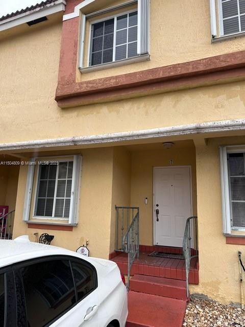 8260 Northwest 10th Street, Unit 7 Miami, FL 33126 - Photo 2 of 23 a front view of a house with parking space