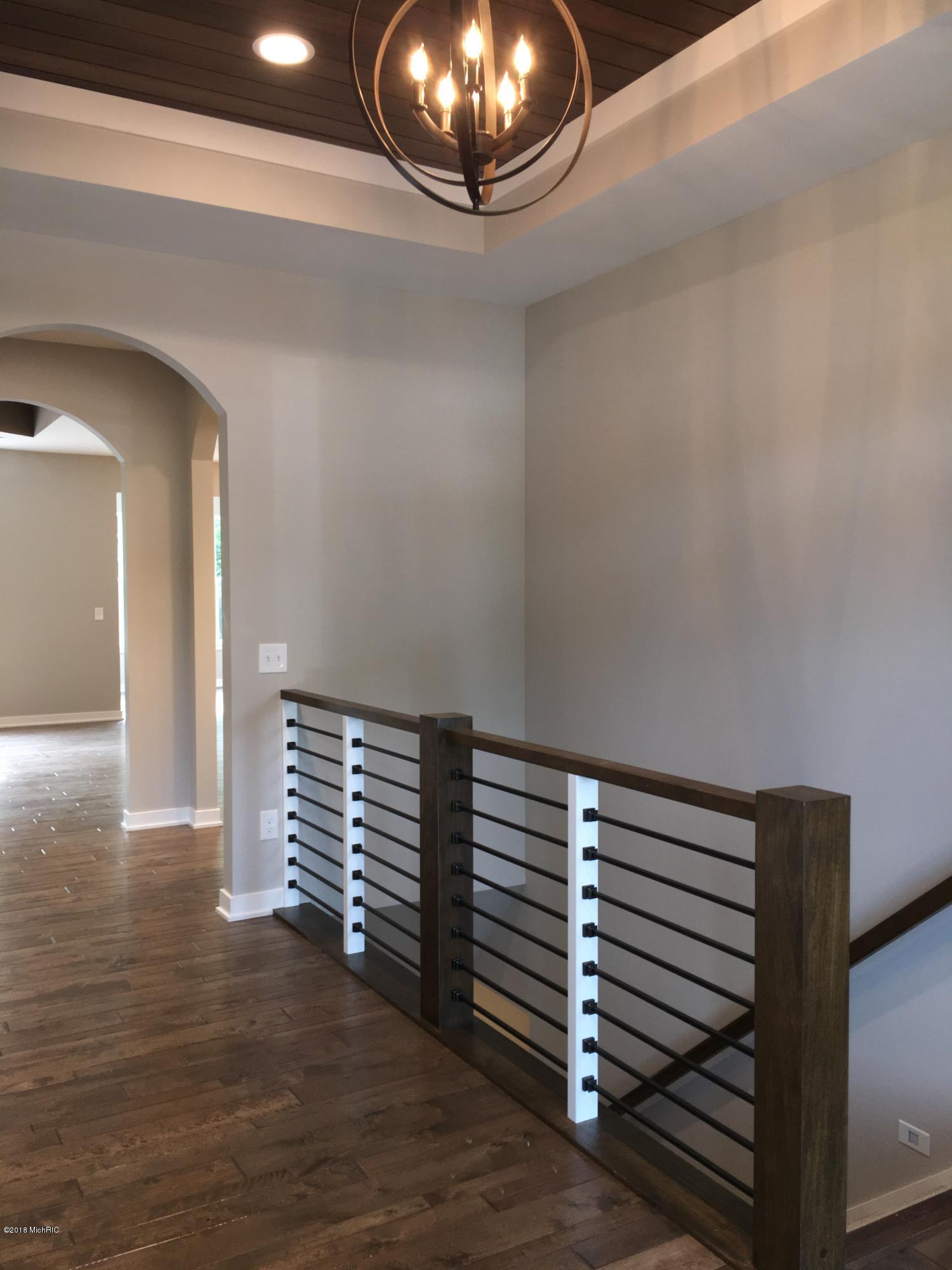 3427 Dunns Ridge, Unit 45 Kalamazoo, MI 49009 - Photo 3 of 28 Foyer with horizontal stair railing