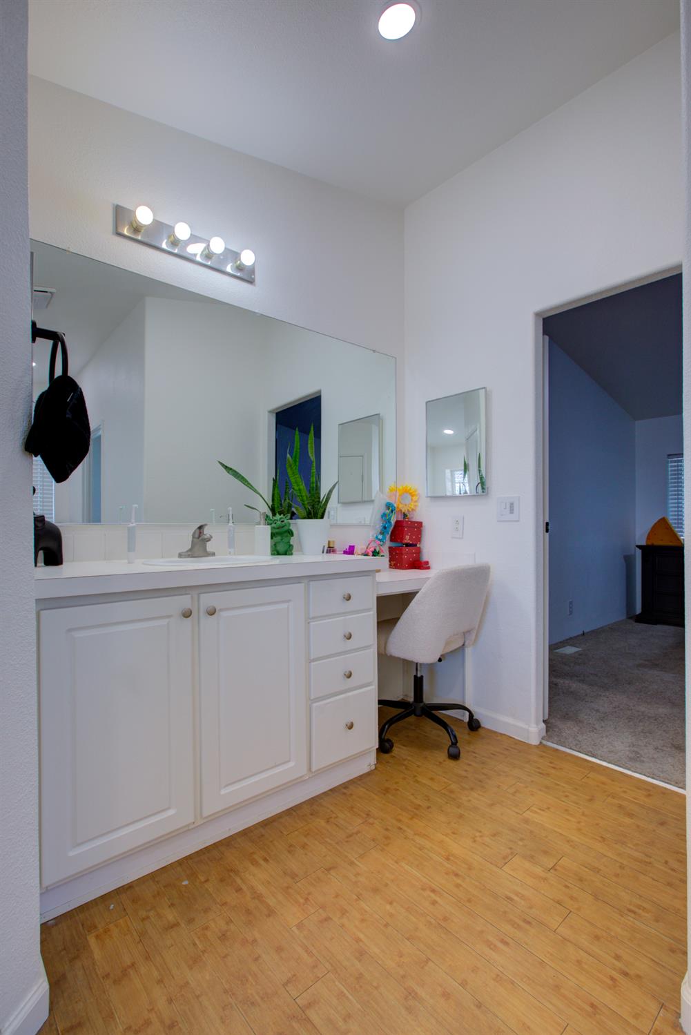 6450 North Winton Way, Unit 76 Winton, CA 95301 - Photo 12 of 36 a bedroom with a bed and a chandelier