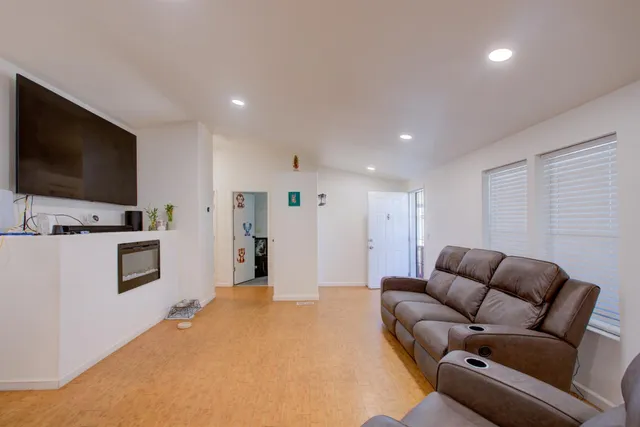a kitchen with refrigerator and a sink