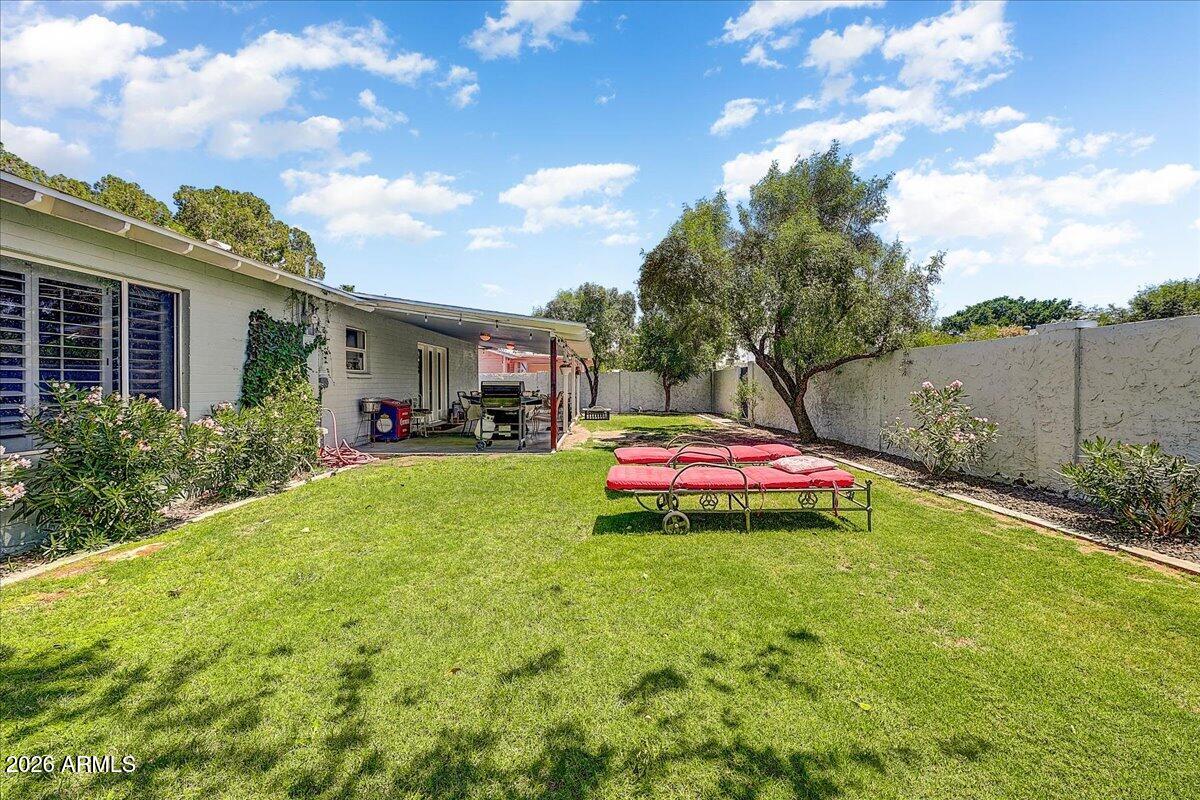 607 West 15th Street Tempe, AZ 85281 - Photo 27 of 29 a view of yard with swimming pool and green space