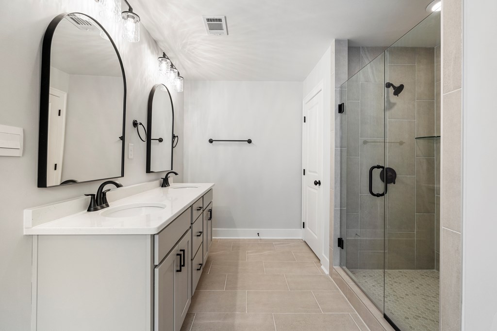 49 Altapass Way Fortson, GA 31808 - Photo 12 of 19 a bathroom with a double vanity sink and mirror