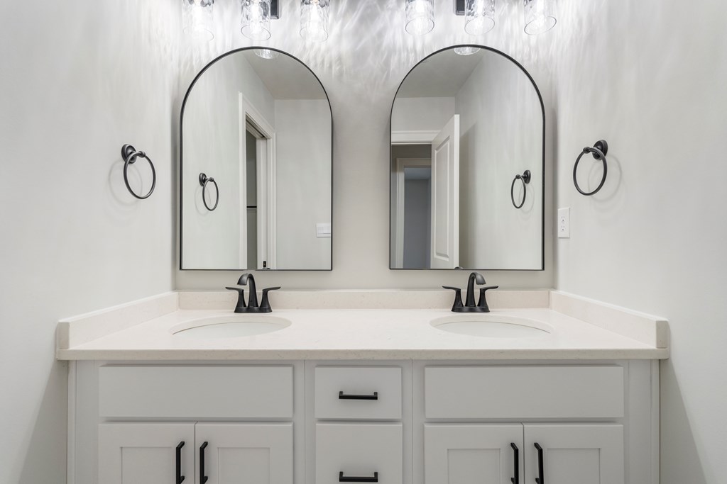 49 Altapass Way Fortson, GA 31808 - Photo 16 of 19 a bathroom with a double vanity sink and a mirror