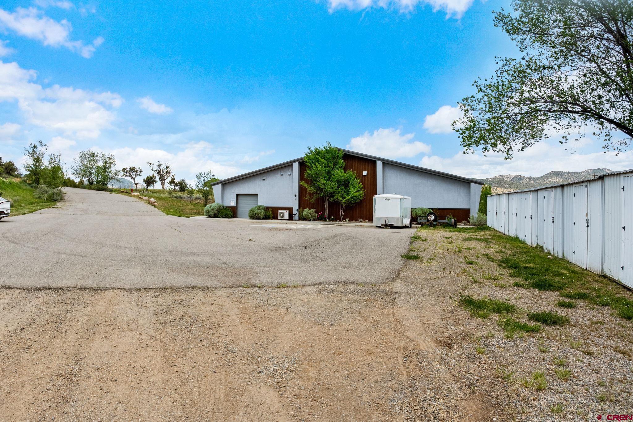 28753 Highway 160 Durango, CO 81301 - Photo 2 of 12 a view of a house with a yard and garage