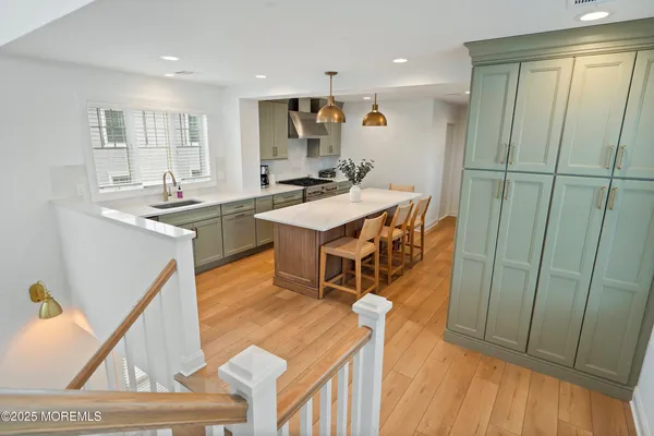 a bedroom with furniture and wooden floor