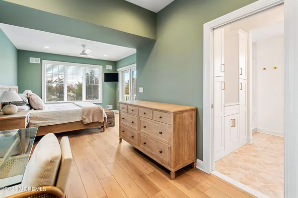 a bedroom with a large bed and a large window