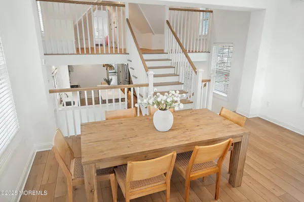 a living room with fireplace furniture and a large window