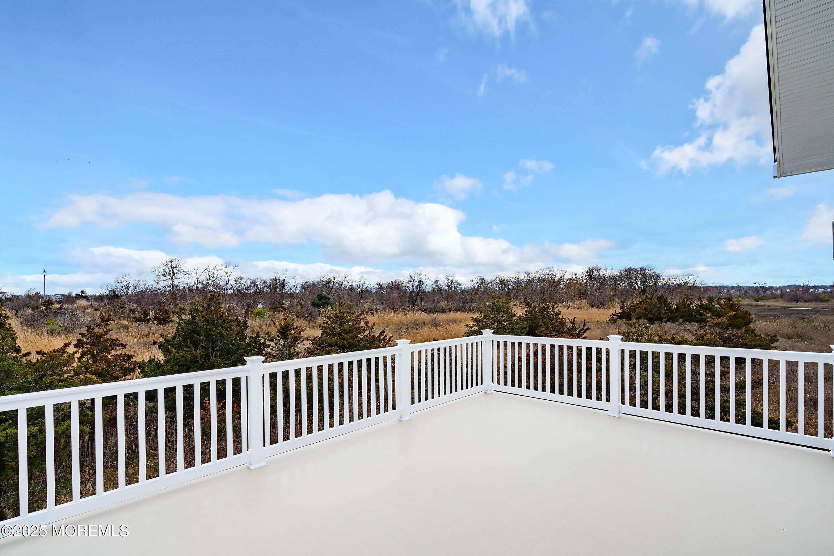 543 Brielle Road Manasquan, NJ 08736 - Photo 21 of 36 a balcony with wooden floor