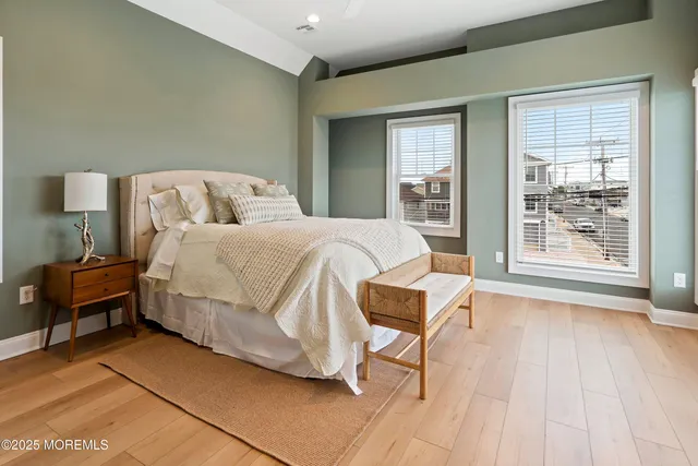 a bathroom with a sink a toilet and a window