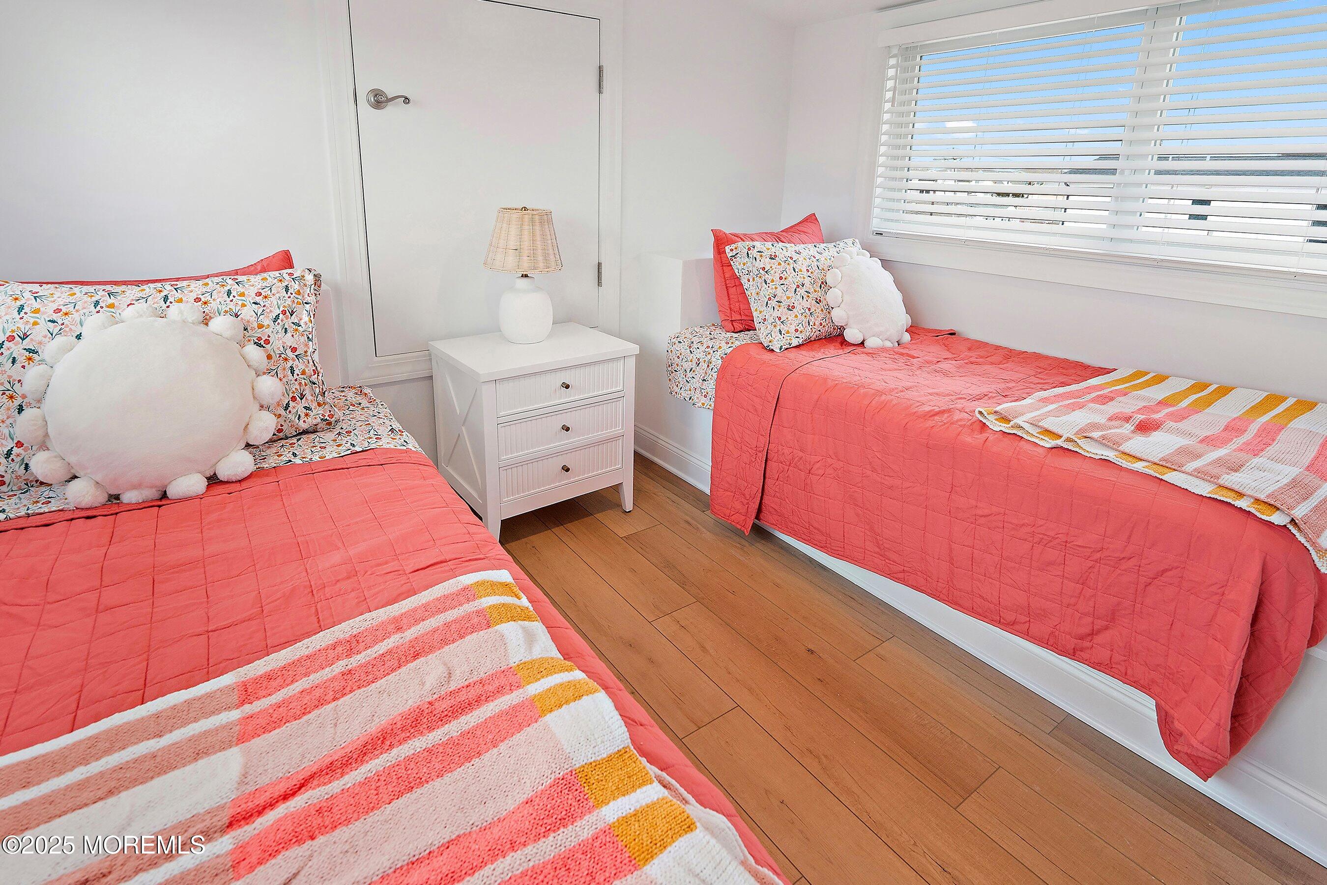 543 Brielle Road Manasquan, NJ 08736 - Photo 32 of 36 a bedroom with a bed and window