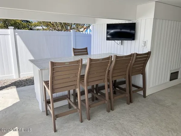 a kitchen with a table and chairs