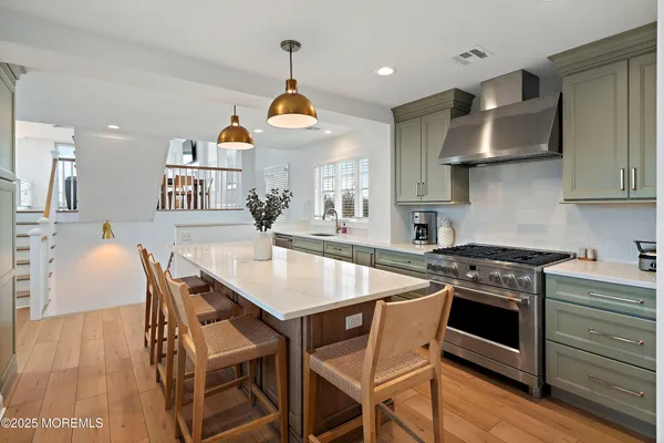 a kitchen with a table and chairs