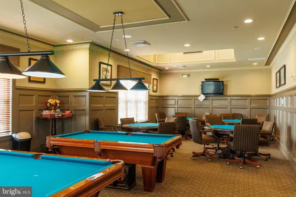 a room with gym equipment and a large window